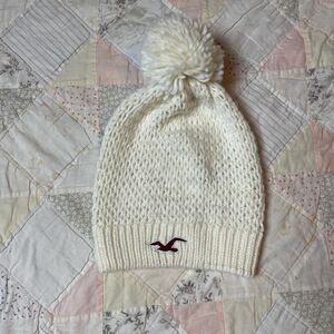 hollister y2k knit wool nylon acrylic pom pom beanie with maroon seagull